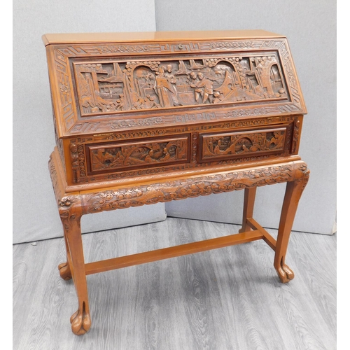 546 - Carved drop fronted writing desk with claw feet