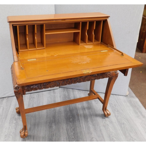 546 - Carved drop fronted writing desk with claw feet