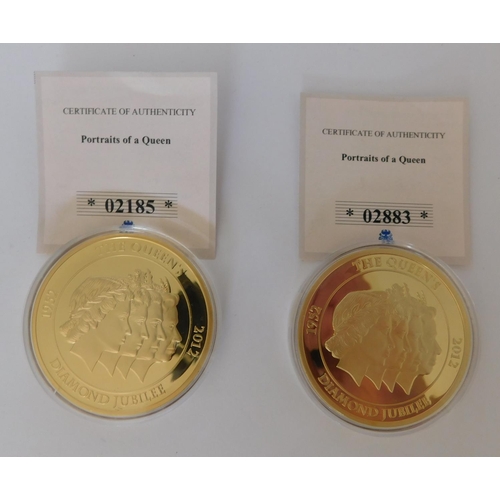 111 - Two large 50mm diameter gold plated Portrait of a queen coins