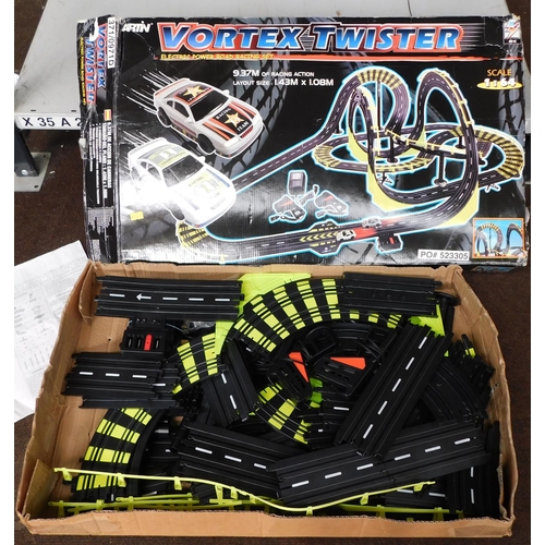 567 - Artin Vortex twister with 2x cars, controllers and toy racing track W/O