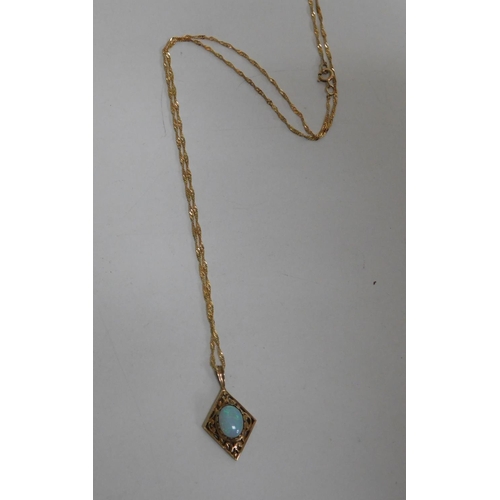 119 - 9ct Gold chain with stunning opal diamond shaped pendant