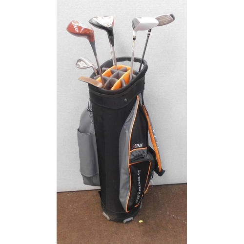 730 - Dunlop golf bag with 7x woods and putters
