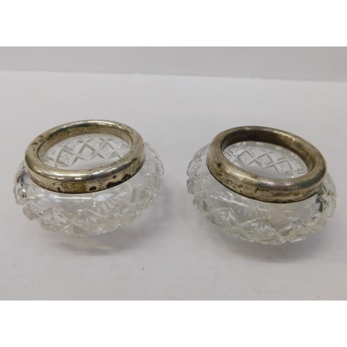 99 - 2x Vintage silver topped salt dishes