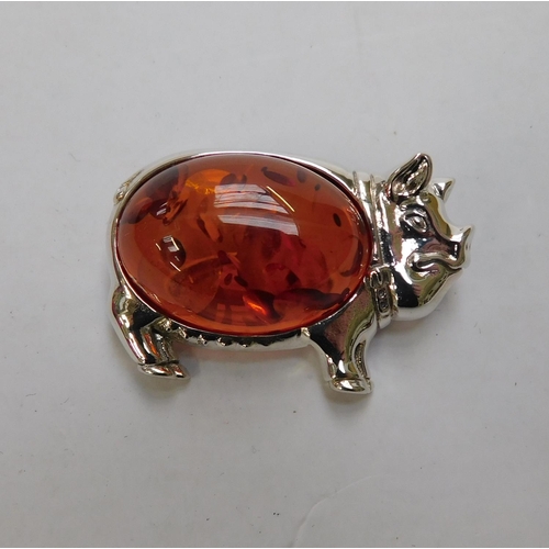 112 - Silver and amber pig brooch