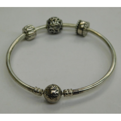 133 - Genuine 925 Pandora bangle with 1 charm & 2 clip spacers