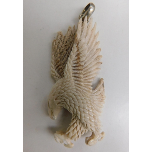 129 - Finely carved antler horn eagle pendant