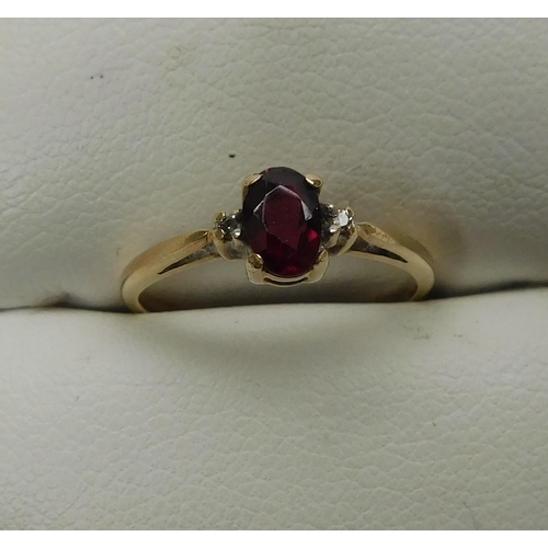 140 - 9ct Gold diamond and garnet ring size L 1/2
