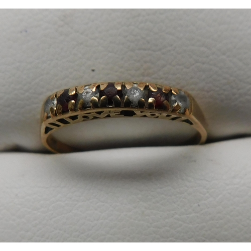 141 - 9ct Gold garnet 'I Love You' half eternity ring