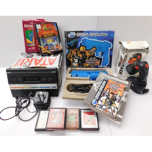 90 - Vintage Atari 2600 console with 7 games + Sega joy stick & Sega Saturn gun