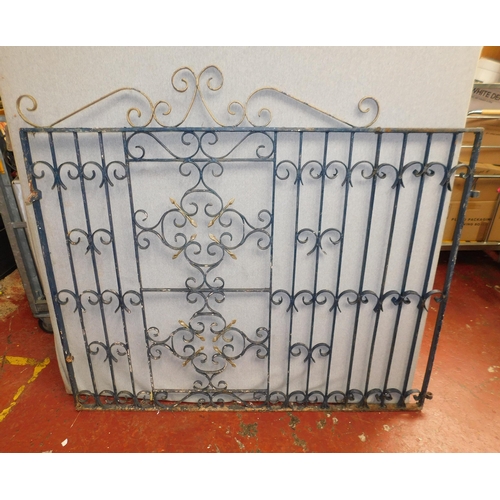 768 - Pair of wrought iron heavy decorative drive gates - approx. 56
