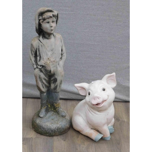 551 - Two stone garden ornaments (boy and pig)