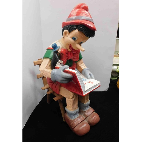 1 - Large resin Pinocchio on wood seat - approx 26