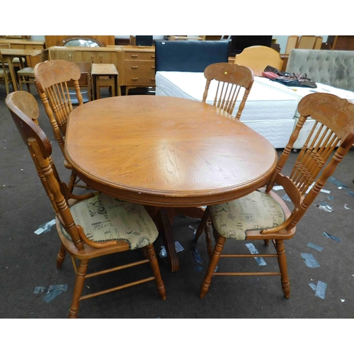 550 - Oval extending dining table & 4 carved chairs