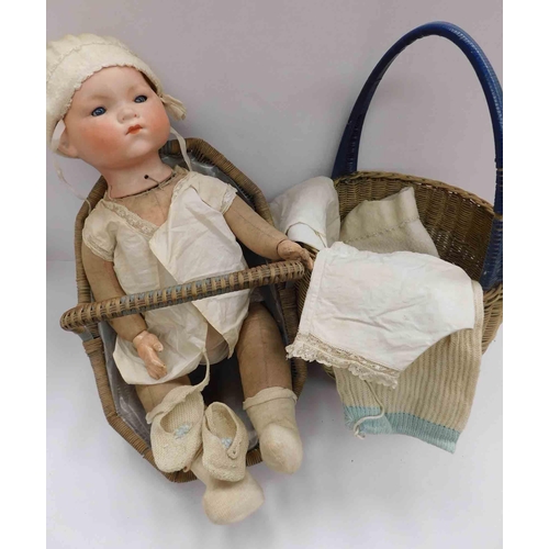 36 - Antique German doll - straw filling with ceramic head - 2 baskets & set of clothes