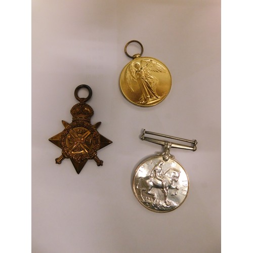 230 - WWI era militaria including - 5th Lancers medal trio, shoulder tiles & Christmas tin