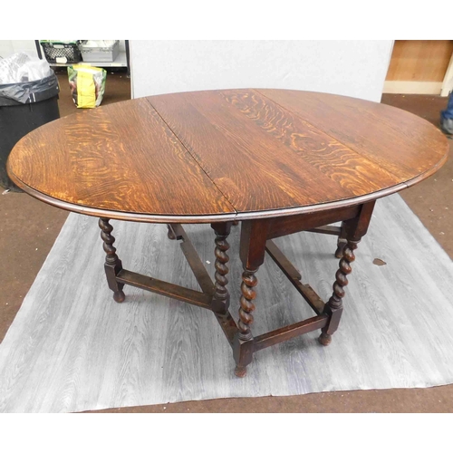 763 - Oval oak drop-leaf table - 60