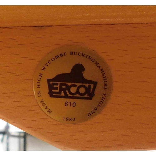 768 - Circular Ercol drop leaf table and 6x chairs