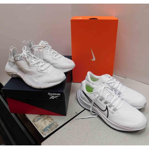 570 - Pair of Reebok white trainers - size 6 and pair of Nike white trainers - size 7