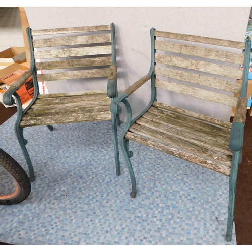 639 - Pair of heavy cast chairs