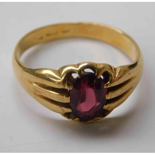 126 - 18ct Gold - oval garnet set ring - total combined weight 4.7g - worn inscription inside, size R