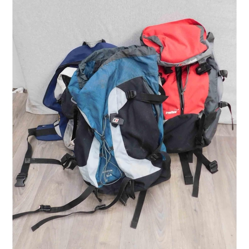 593 - Three backpacks/rucksacks (two with back frames)