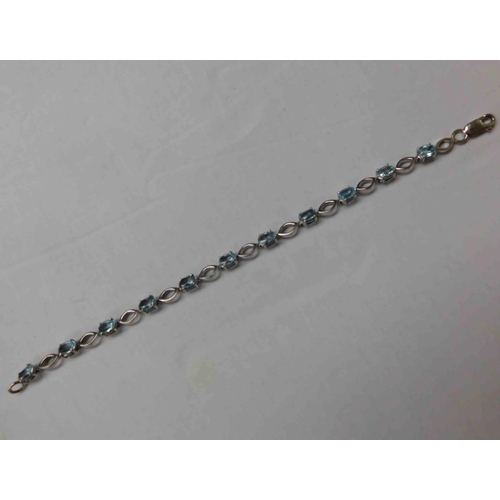 123 - 9ct White gold - blue topaz bracelet