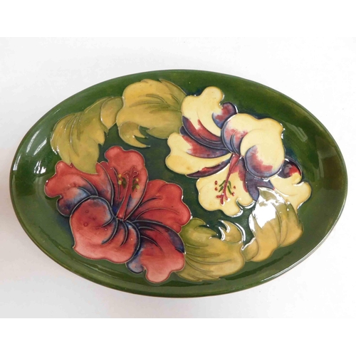 260 - Moorcroft Hibiscus on green dish, approx 9