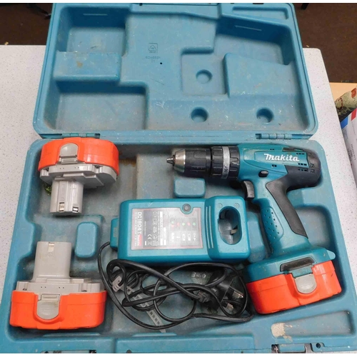 509 - Makita drill with charger & batteries in w/o