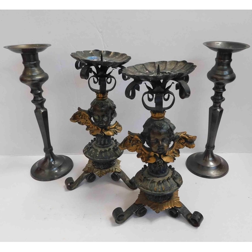 51 - Two - Victorian style cherub candlesticks & pair of brass candlesticks