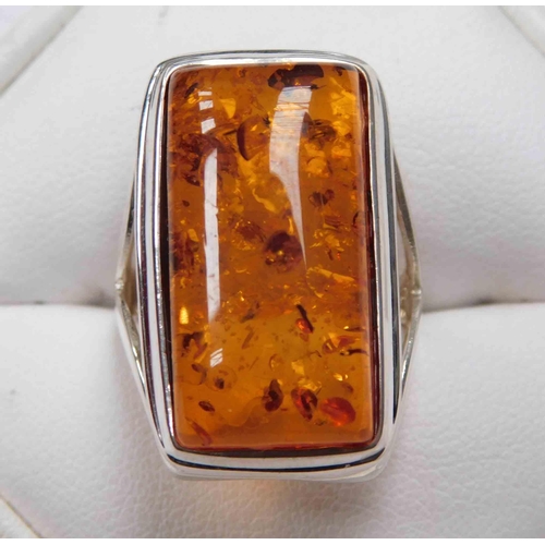 133 - Silver & amber ring