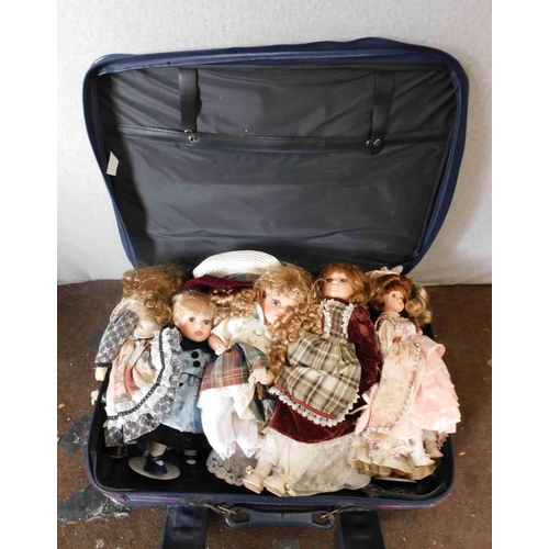 715 - Suitcase of porcelain dolls