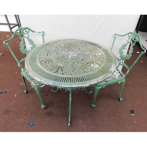 769 - Cast iron garden table and 2x chairs