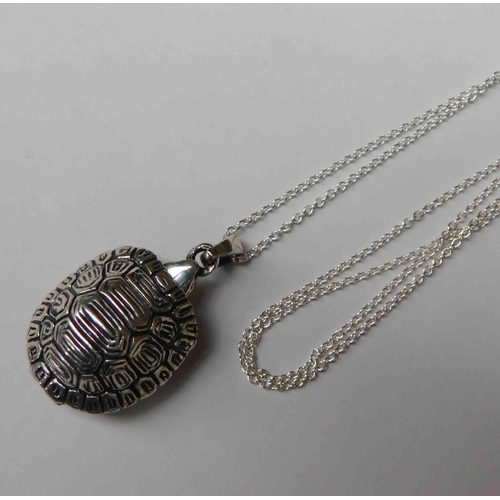 204 - Silver - tortoise locket on silver chain