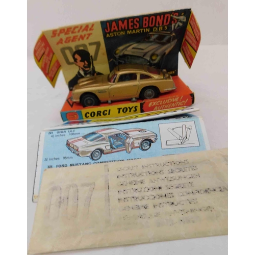 714 - Corgi James Bond Aston martin with both figures and original box