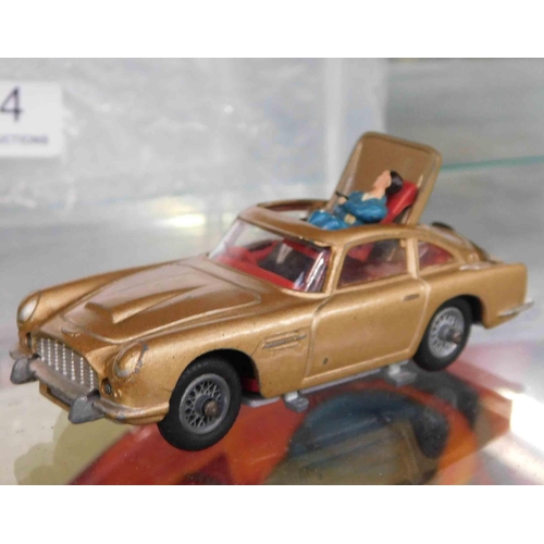 714 - Corgi James Bond Aston martin with both figures and original box