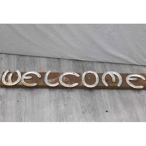 536 - Welcome sign made from horse shoes