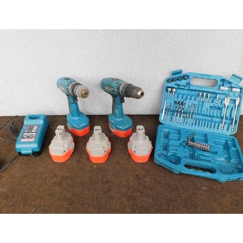 515 - 2 x 18v Makita drills, 5x batteries/chargers and box of Makita accessories (unchecked)