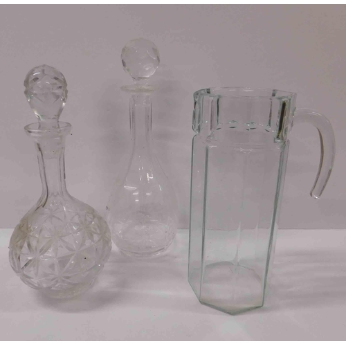 65 - Two - Glass decanters & jug