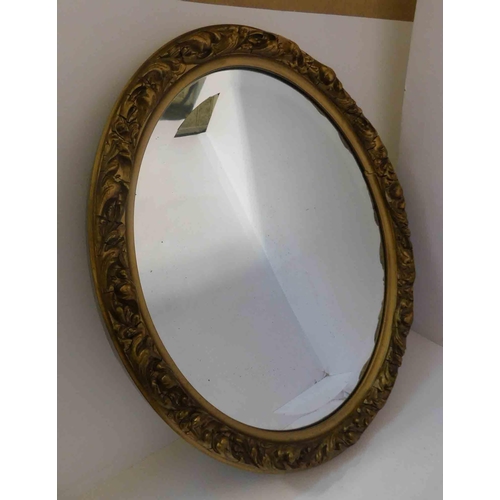 11 - Gilt & relief decorated - oval mirror - approx. 24