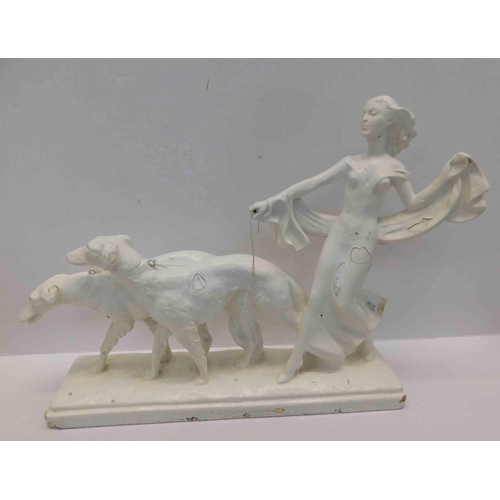 47 - Figural group - painted metal - art deco style walking the dog - approx. length 20