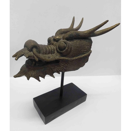 49 - Chinese style - dragon head on plinth...