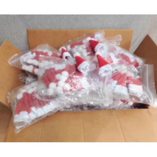 591 - Box of Christmas table decorations including 30 bags mini Santa hats