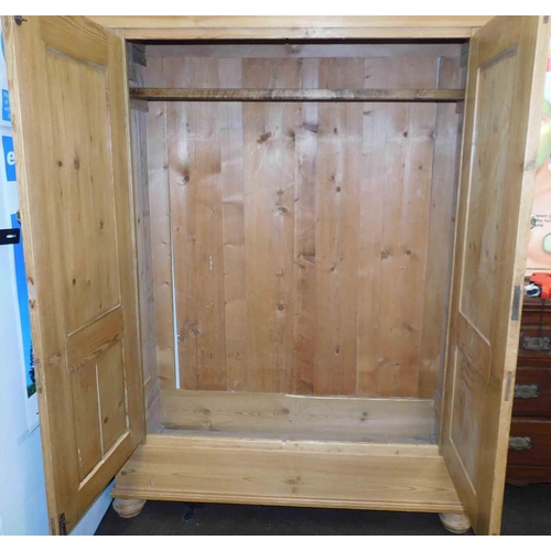 619 - Large solid pine wardrobe