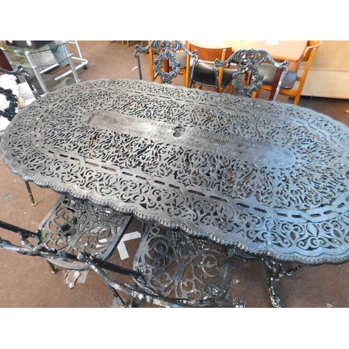 757 - Large cast garden table and 6x chairs