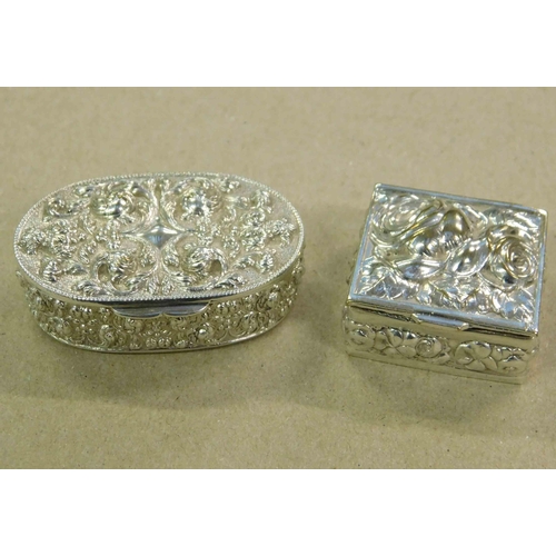 150 - Two - Indian silver - repousse decorated - snuff/pill boxes