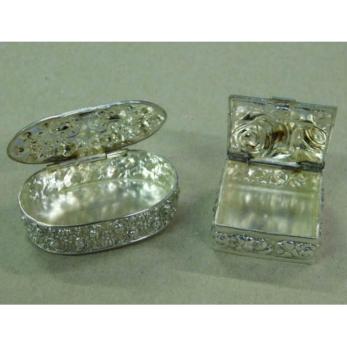 150 - Two - Indian silver - repousse decorated - snuff/pill boxes