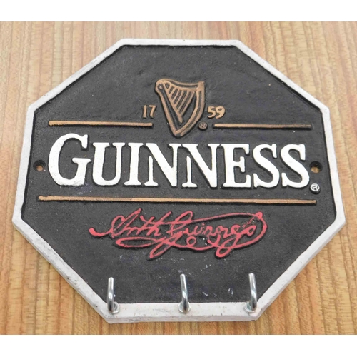 714 - Cast Guinness sign with hooks