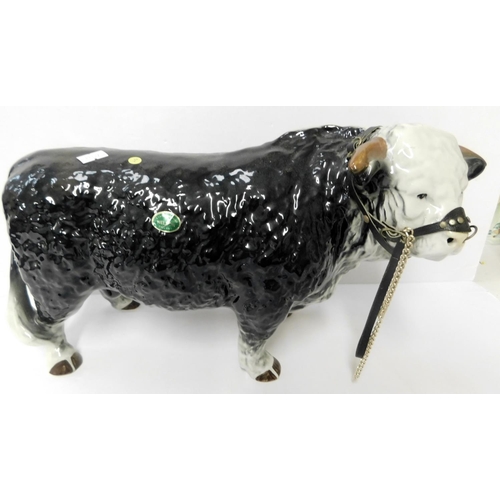 64 - Nelson pottery - Butchers Hereford bull with harness - height 9.75