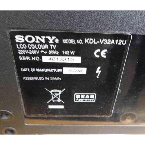 730 - Sony Bravia LCD colour TV in W/O incl. remote and stand plus 2x Freeview boxes
