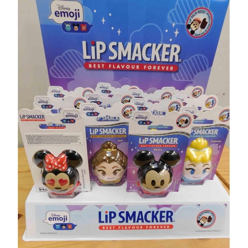 563 - Display stand and contents (12) Disney Emoji lip smacker li balms - 4 flavours